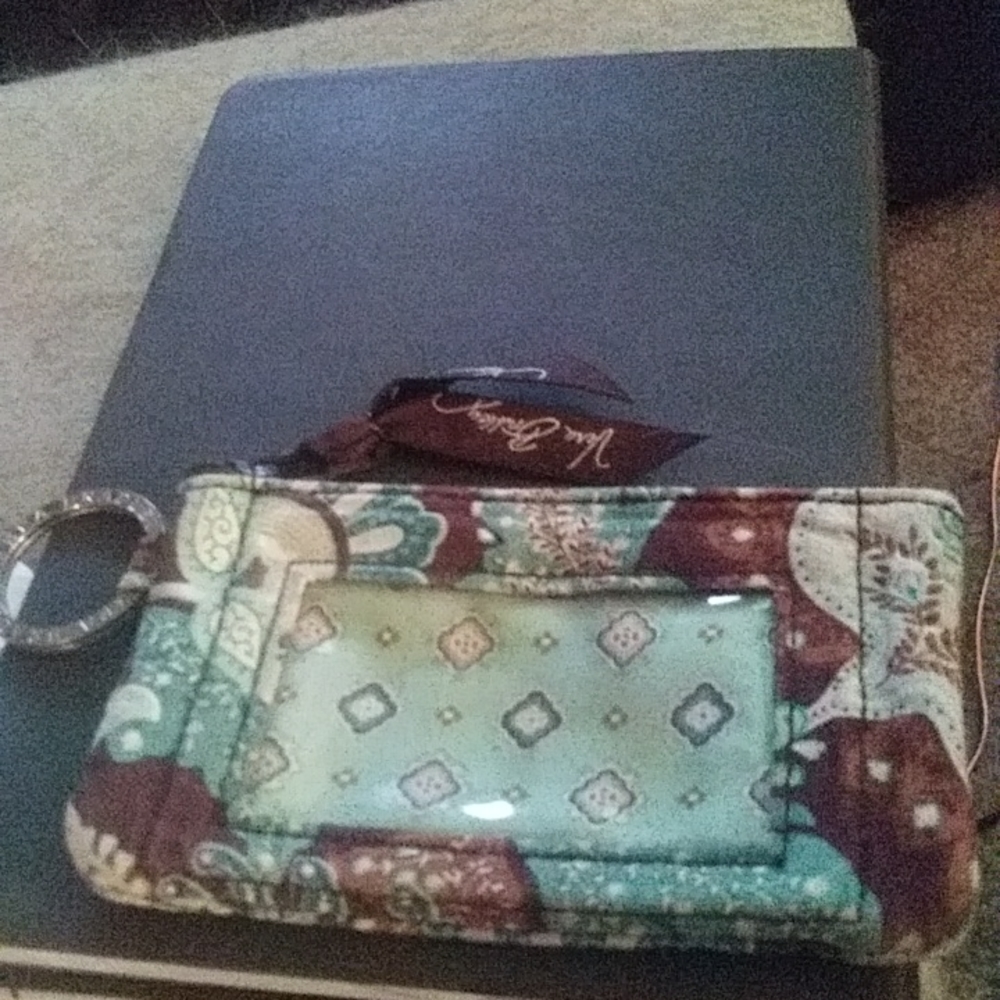 Vera bradley keychain seethrough slot on outside zipper to inside